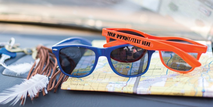 custom sunglasses on a map in a car