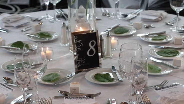 Table setting with greenery wedding theme