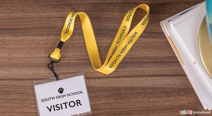 School lanyard with visitor badge