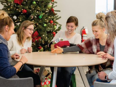 Group of young women playing Christmas party games