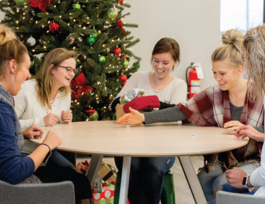 Group of young women playing Christmas party games