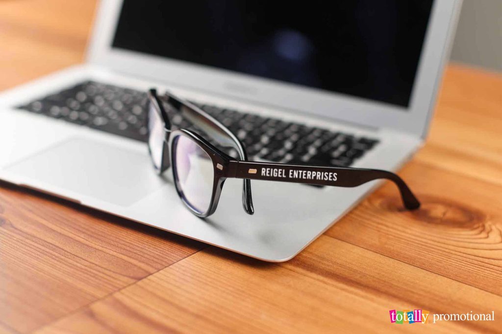 customized blue light glasses with a laptop