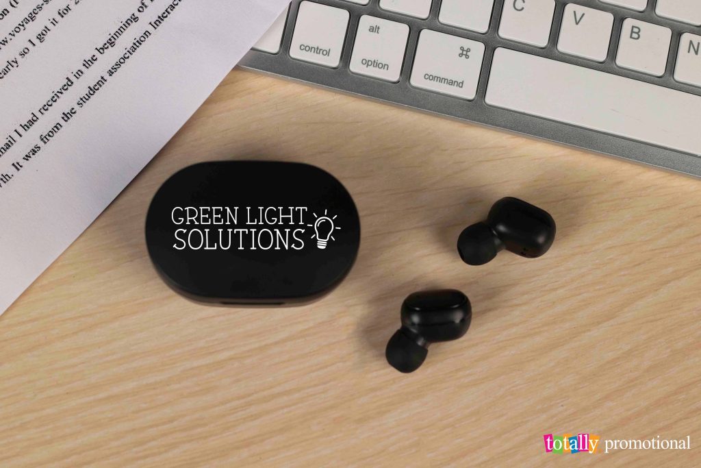 promotional earbuds on a desk