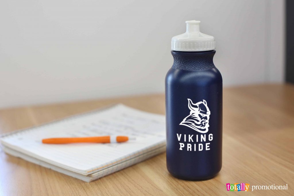 custom printed water bottle and notebook with a pen