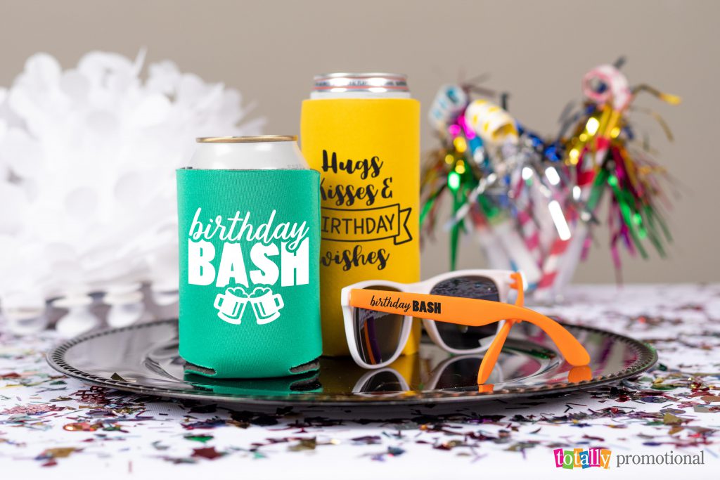 birthday party koozies and sunglasses on table