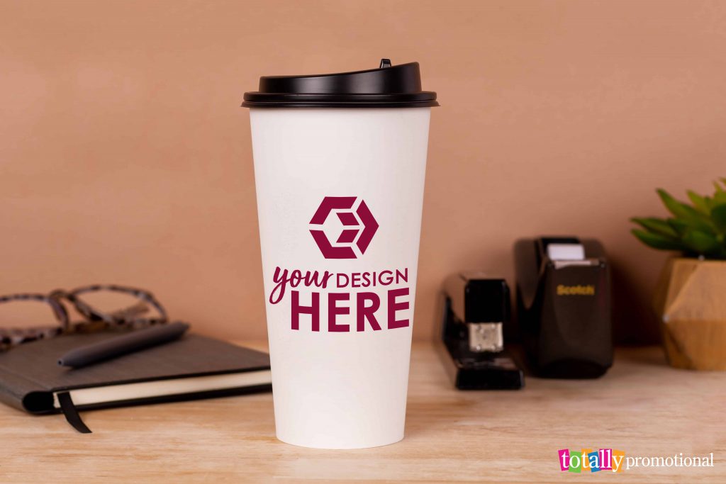 custom paper cup with your design here on a desk