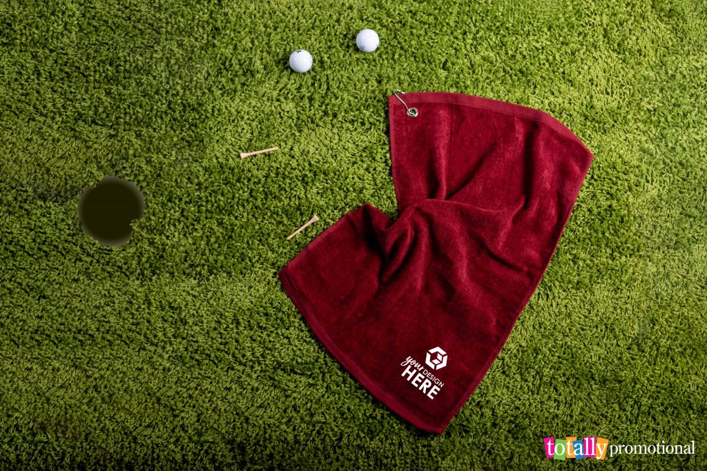 custom red golf towel with golf tees and golf balls