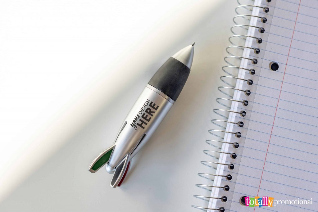 customized novelty pen on a notebook