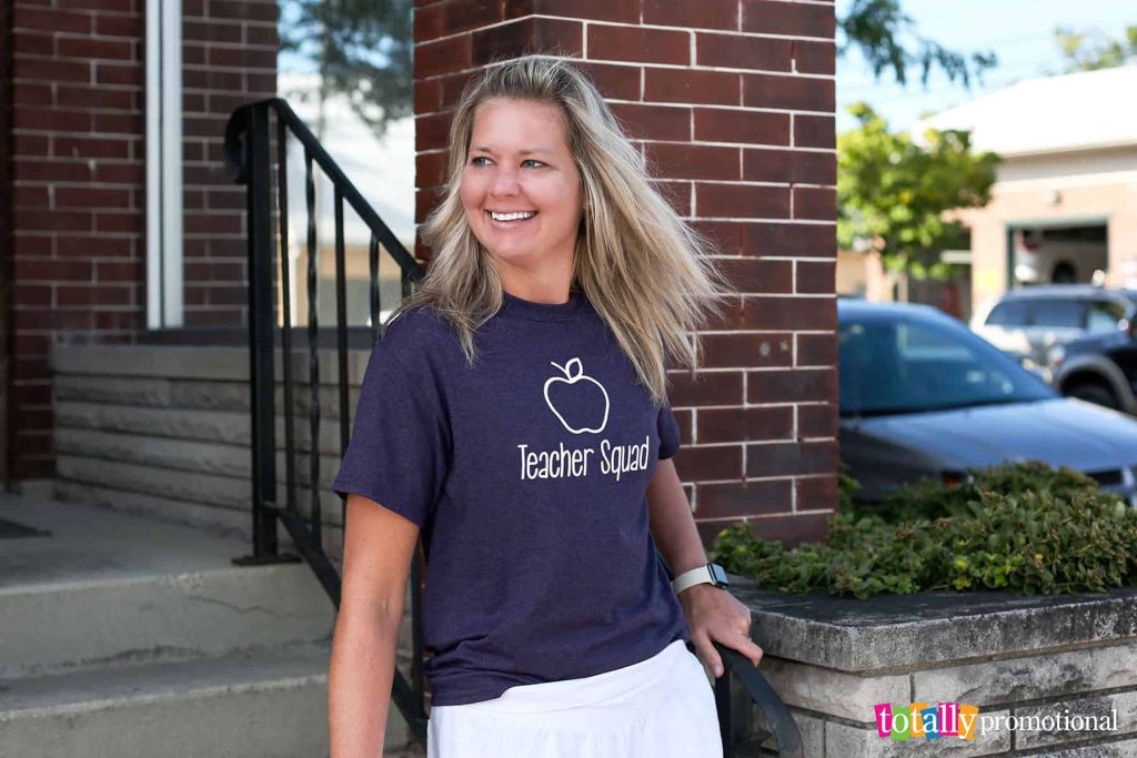 woman wearing a customized teacher quote t-shirt