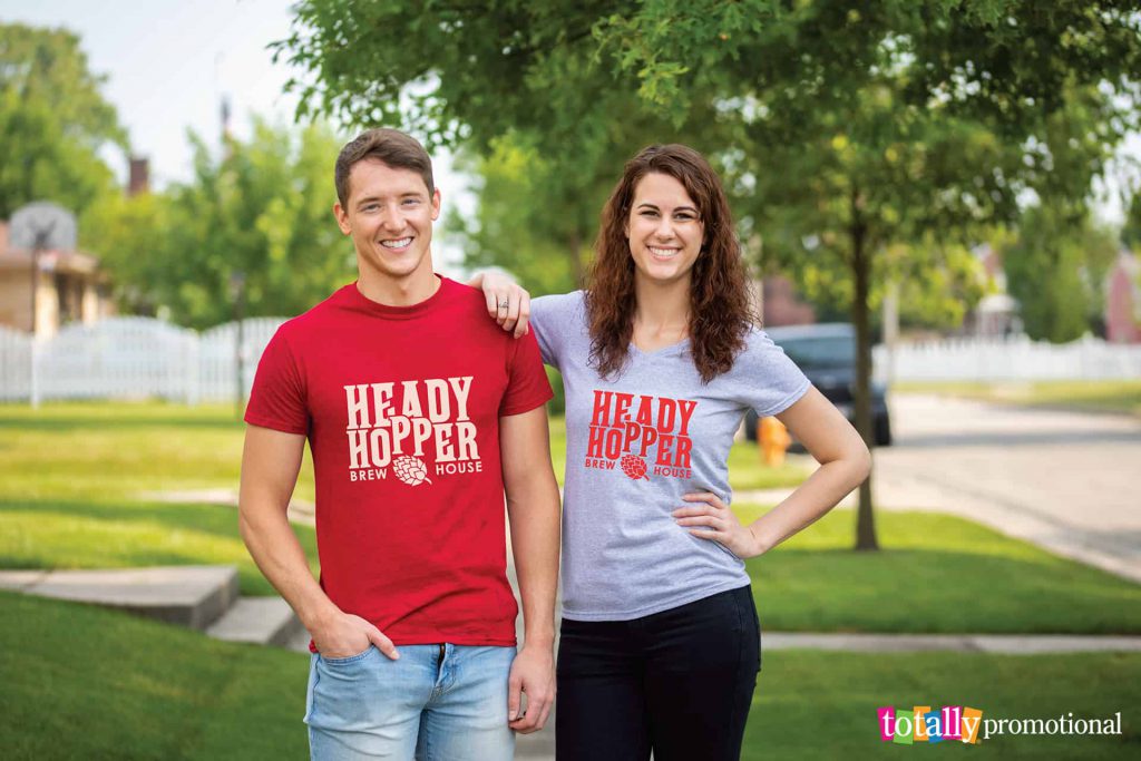 man and woman wearing customized t-shirts outside