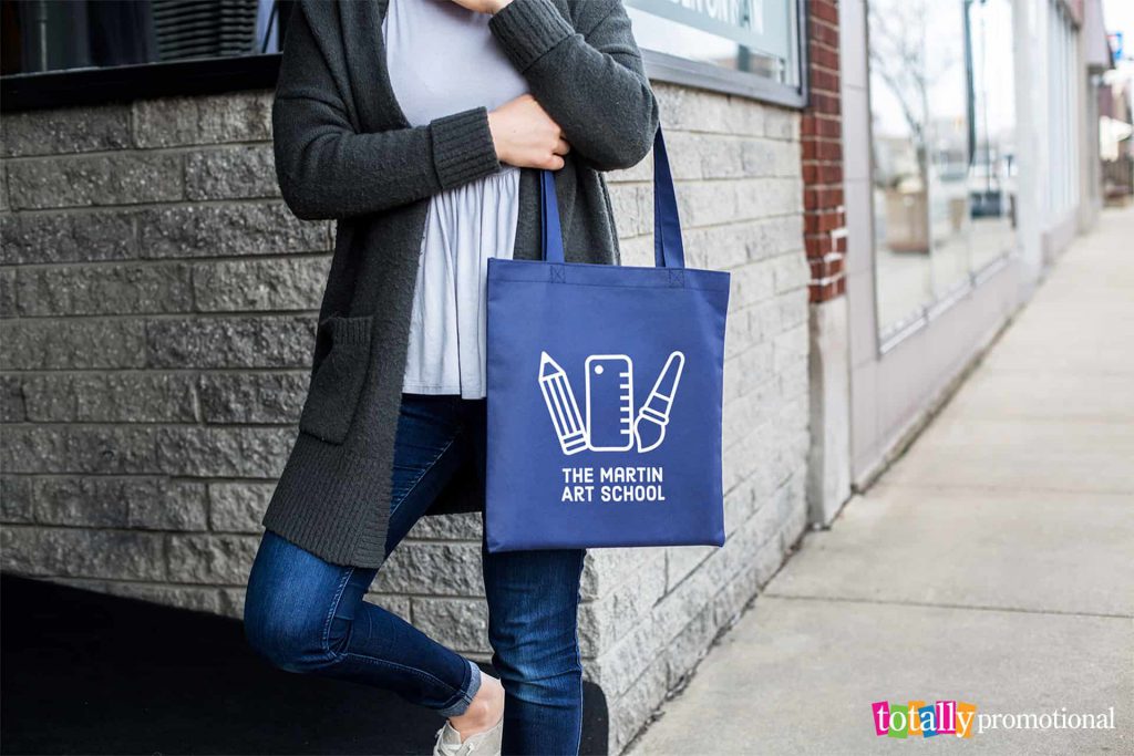 woman carrying a personalized tote bag around town