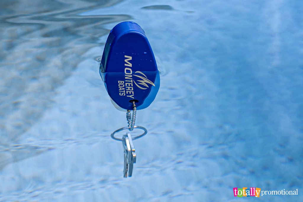 customized oval floater keychain in the water