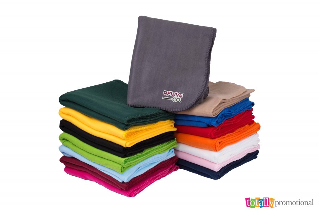 stack of promotional blankets with logo for business