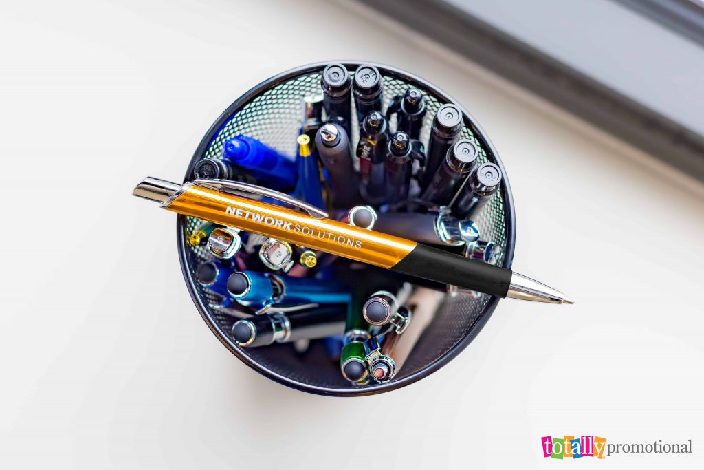 group of custom engraved pens in a pen holder