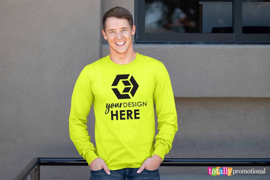 man wearing a bright yellow safety long sleeve t-shirt