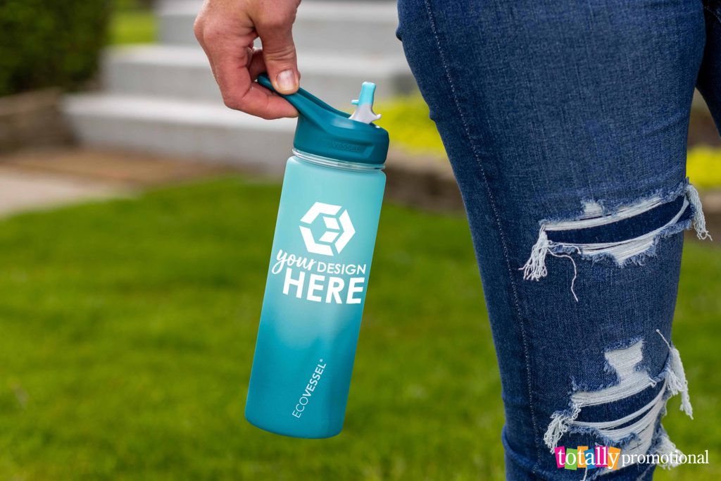 woman holding a customized water bottle
