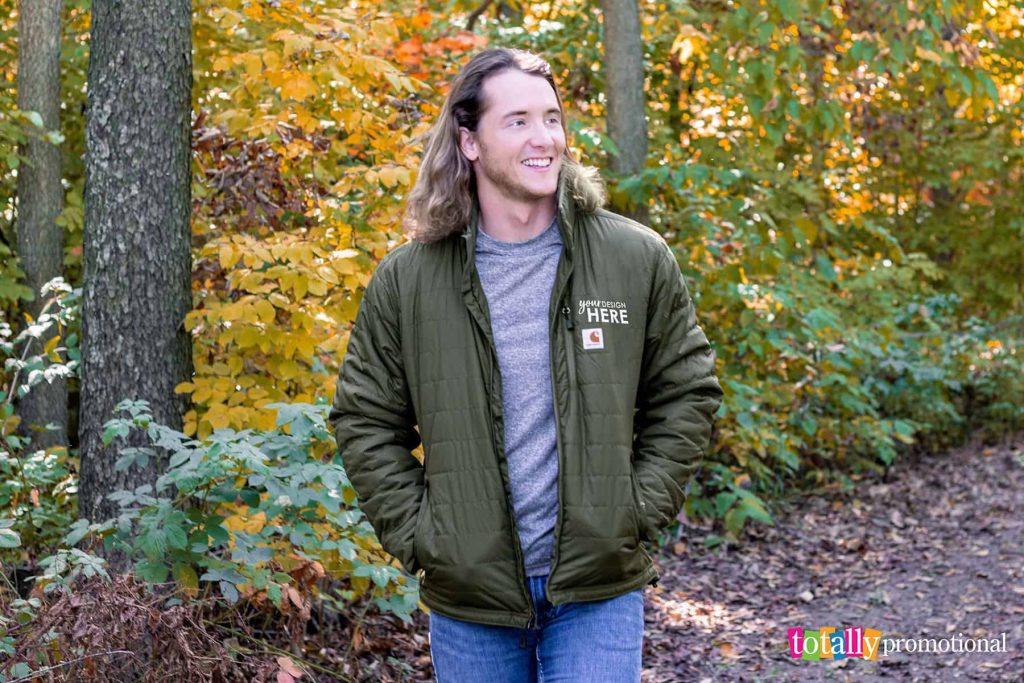 Man wearing a customizable jacket in the woods