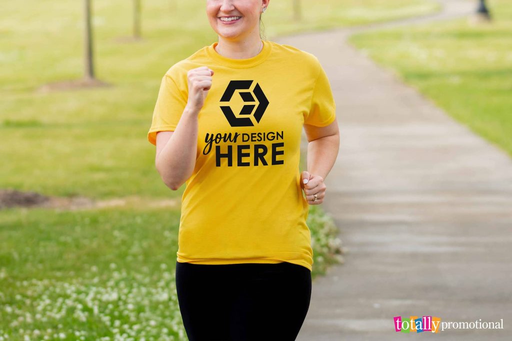 woman running wearing a customizable t-shirt