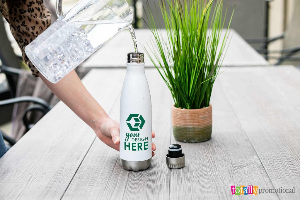 filling a customizable eco-friendly water bottle with water